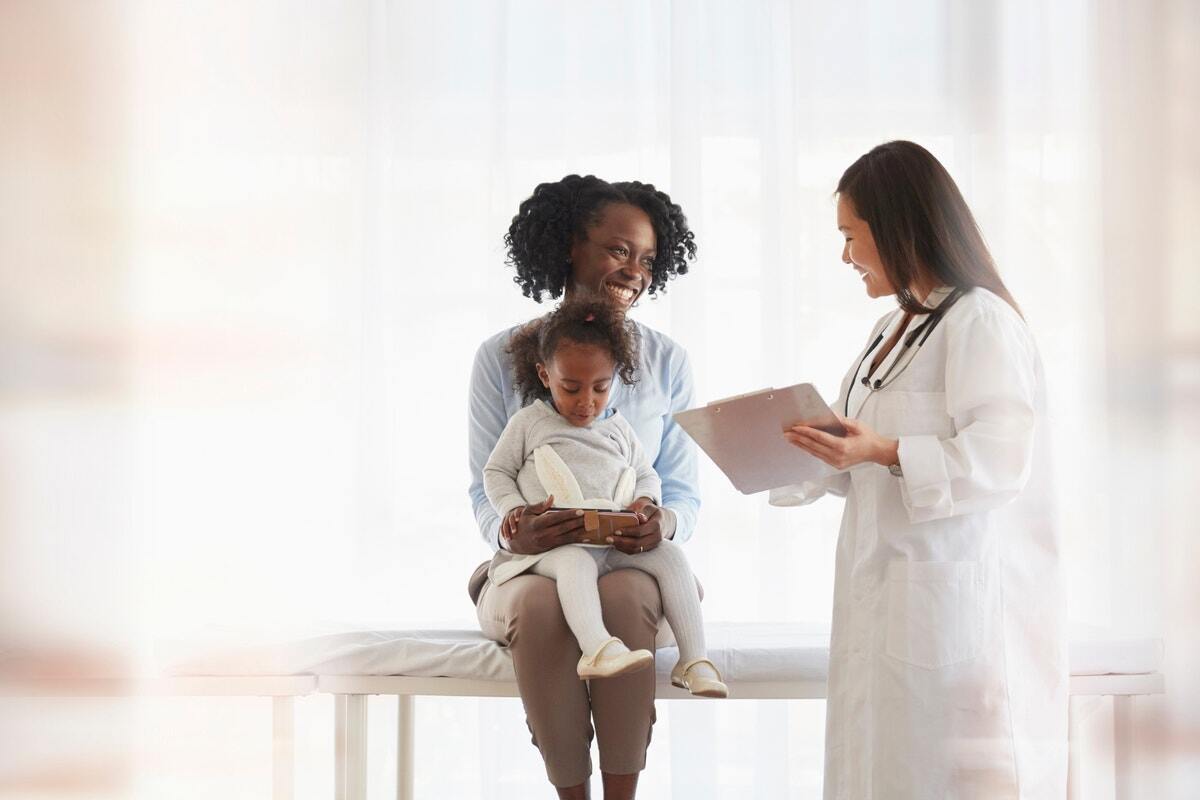 Parent with child and healthcare professional